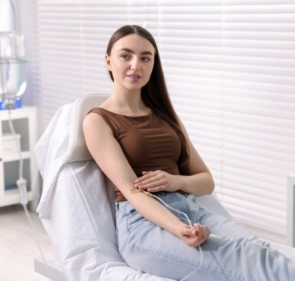 Young,Woman,With,Iv,Drip,In,Hospital