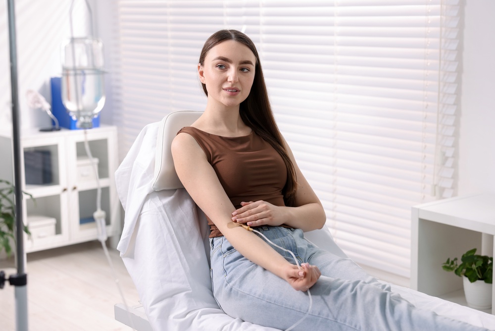 Young,Woman,With,Iv,Drip,In,Hospital
