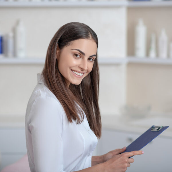 Cosmetologist.,Pretty,Young,Professional,Standing,In,The,Room,And,Looking