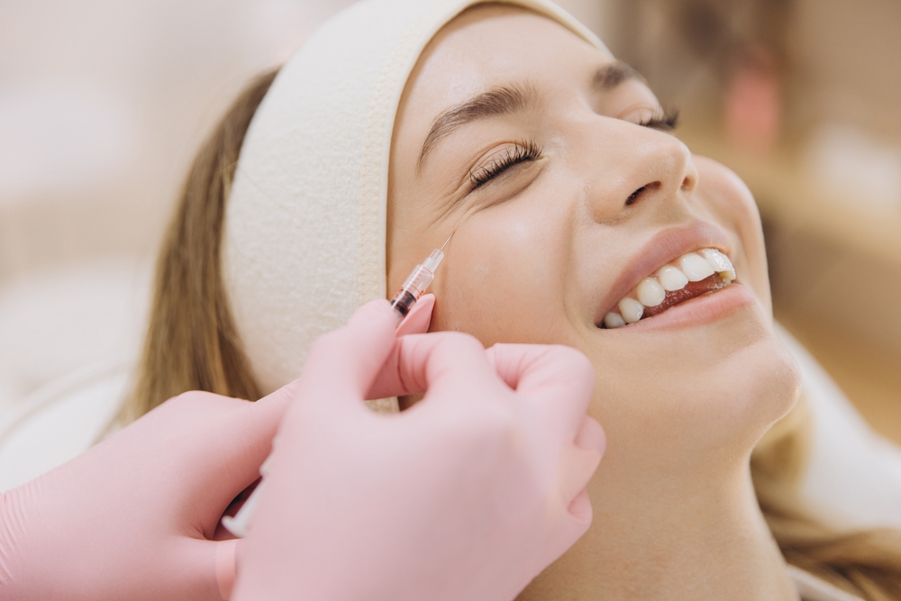 Woman receiving a professional facial aesthetics treatment